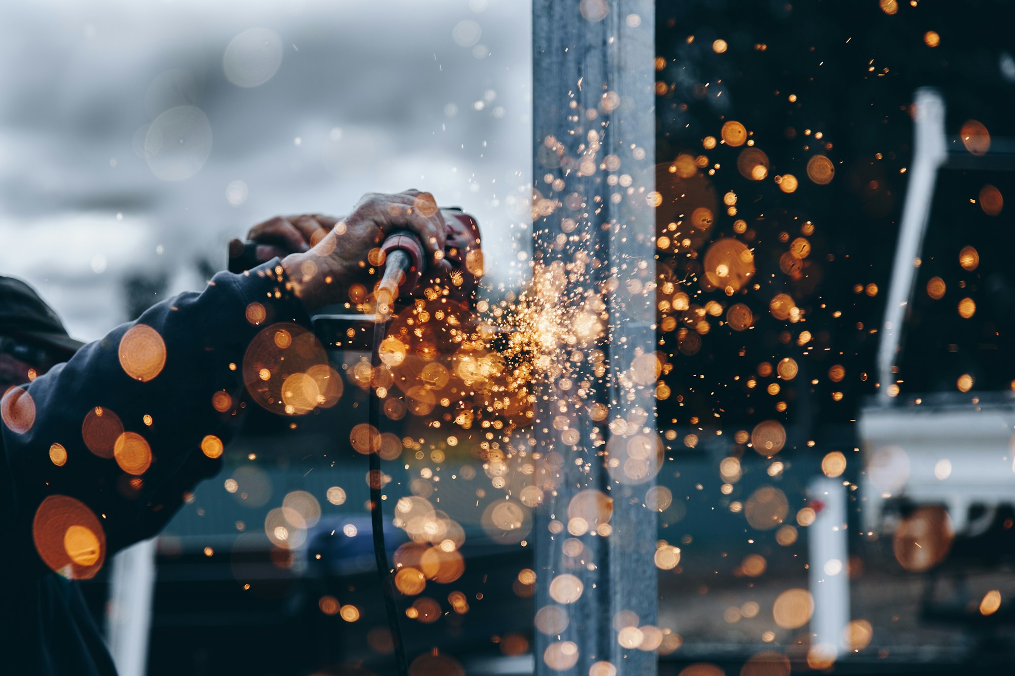 Metalworking with sparks; stock photograph, not a Studio Forma facility