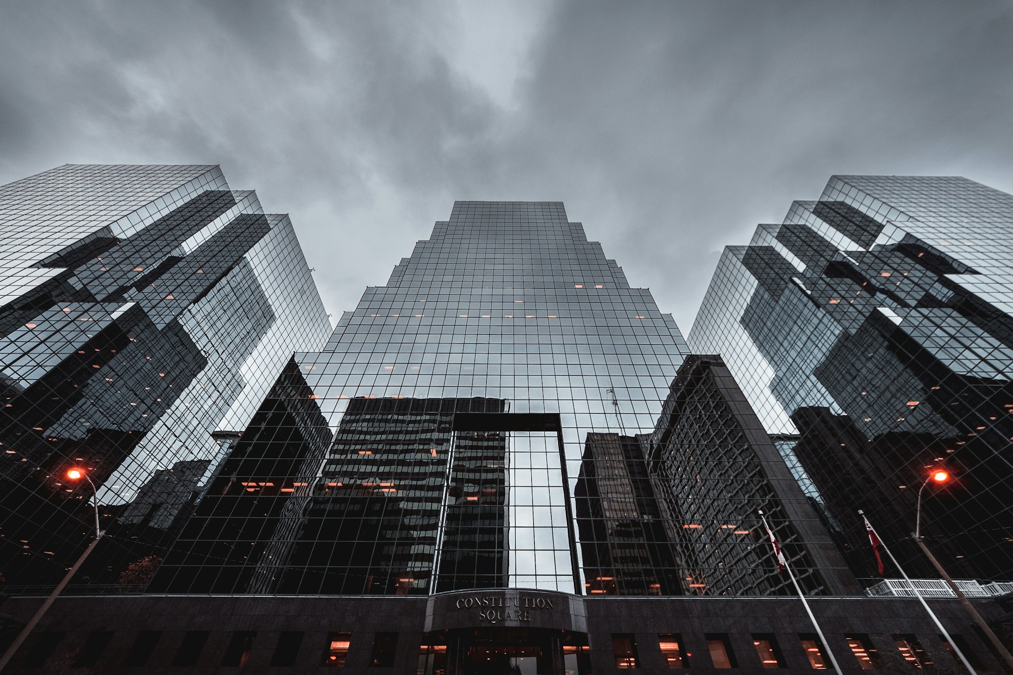 Glass office towers seen from below; illustrative stock architecture