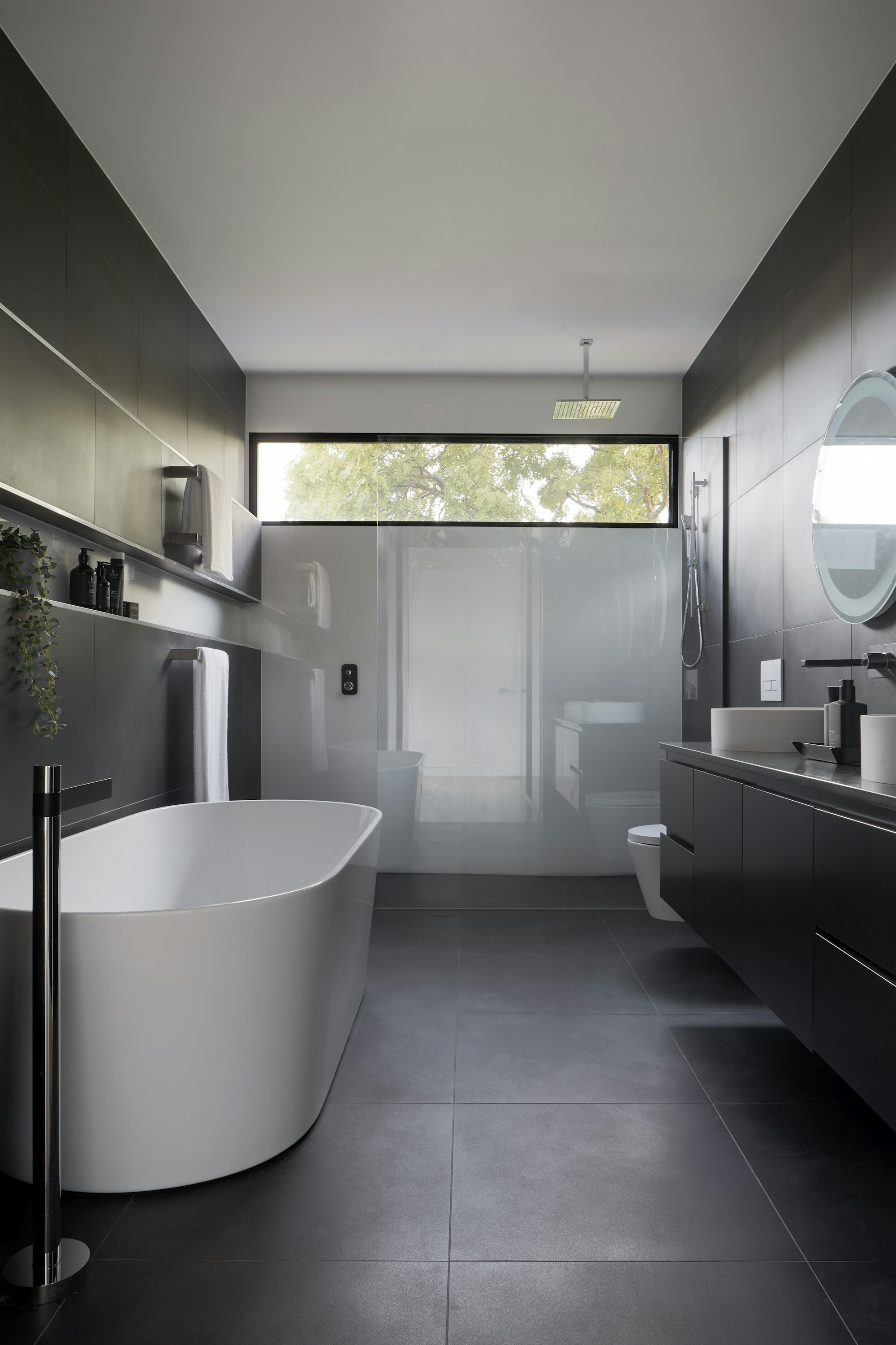 A contemporary bathroom with a freestanding bath; stock design reference